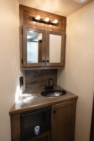 Sink in Bathroom in LE8X15SR Charger Edition Livestock Trailer | Lakota Trailers
